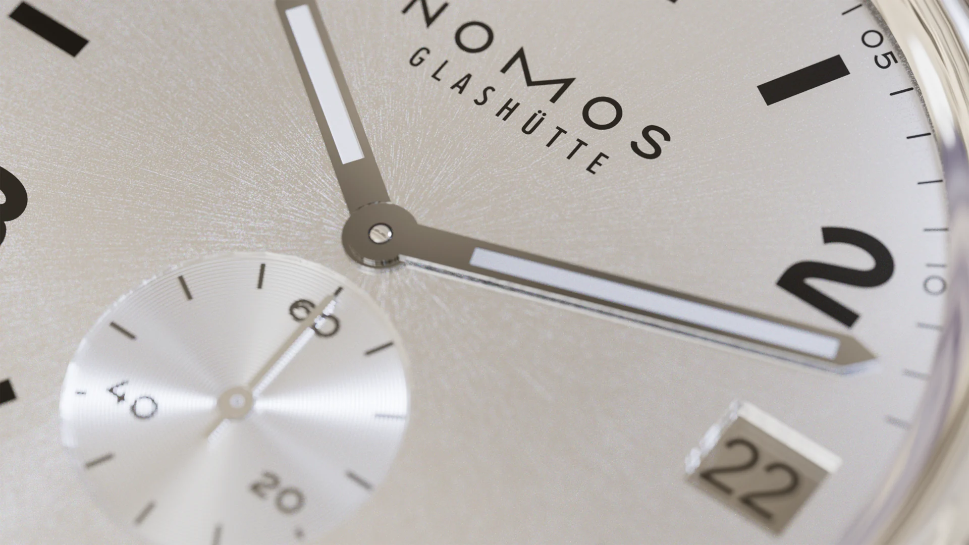 Layered silver NOMOS dials and typography